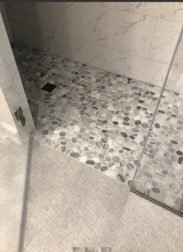Island stone shower floor flush to bathroom floor